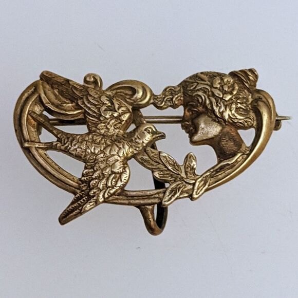 Victorian Lady holding Bird Brooch